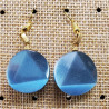 paire de boucle d'oreille en triangle dans un cercle symbole de force bleu