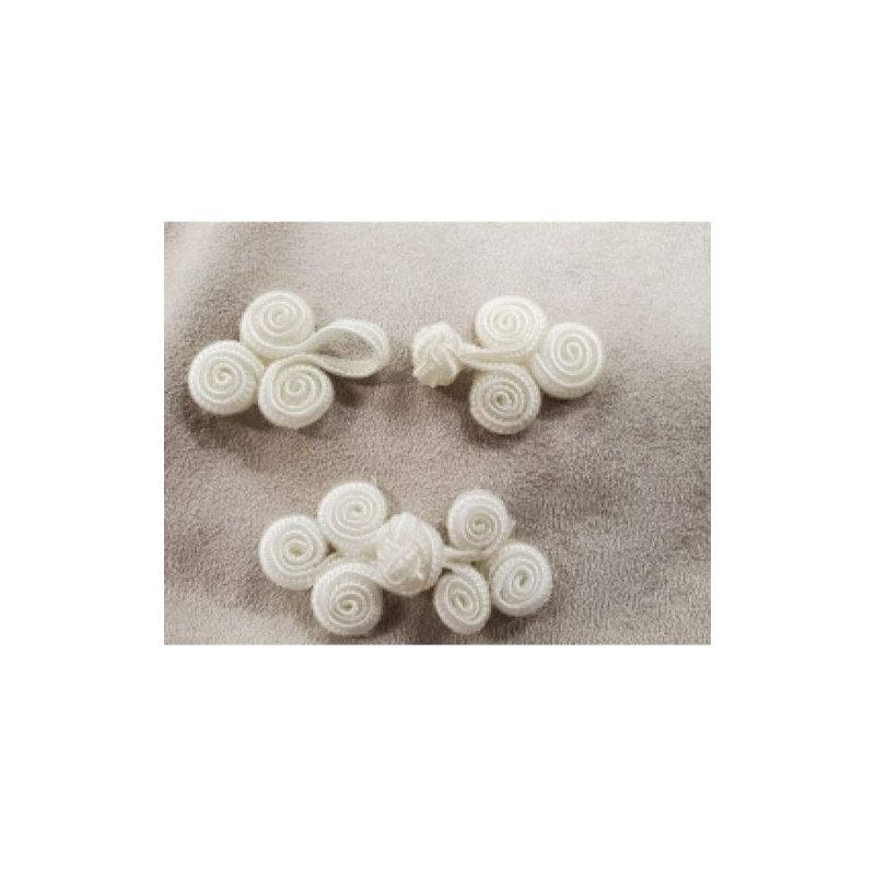 BOUTON BRANDEBOURG-  Blanc longueur 5.5 cm sur largeur de,2.5 cm