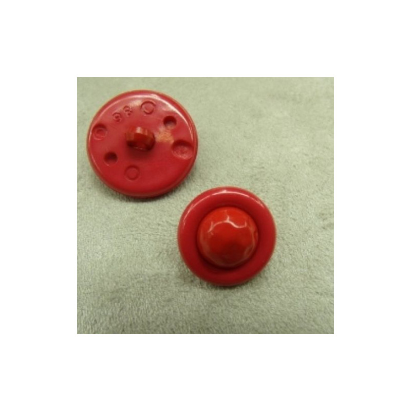 bouton acrylique composé sur fond rouge