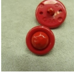bouton acrylique composé sur fond rouge