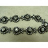 ruban grand strass entouré de 12 petit strass 